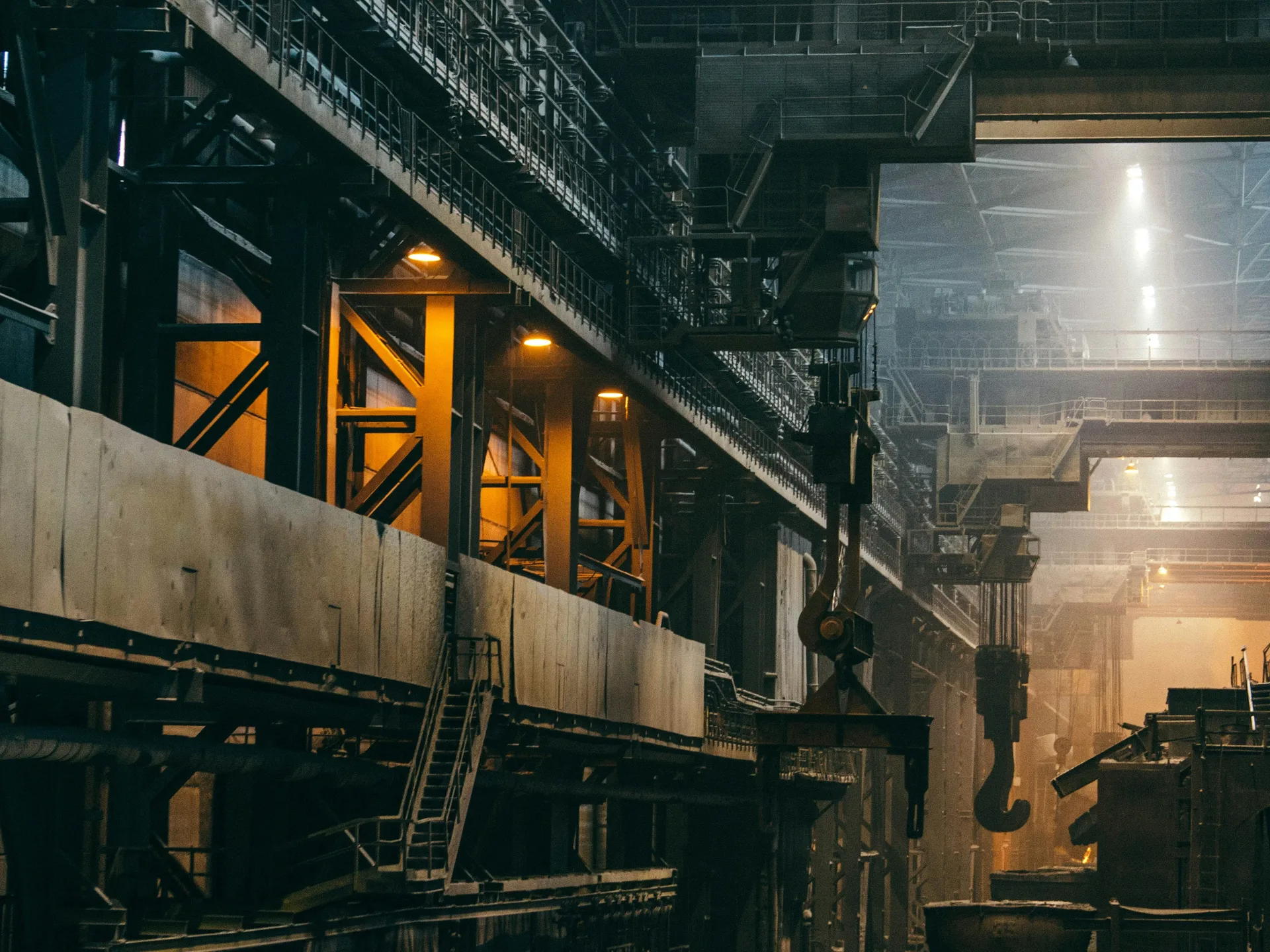 Industrial production hall with overhead crane and process equipment